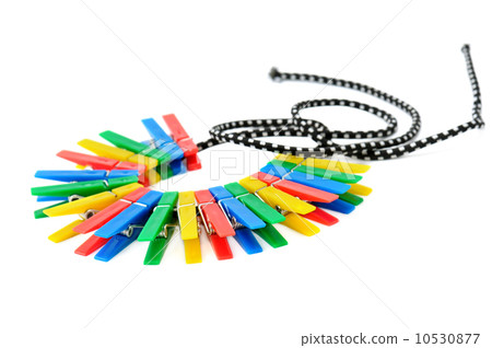 clothespins on a rope isolated on white background 10530877