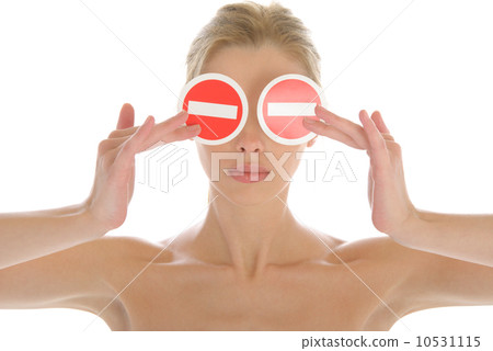 Woman holds two prohibiting signs before eyes 10531115