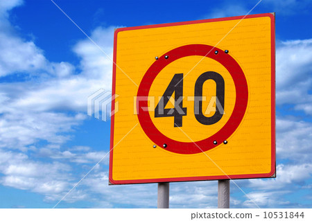 Speed limit road sign above blue cloudy sky 10531844