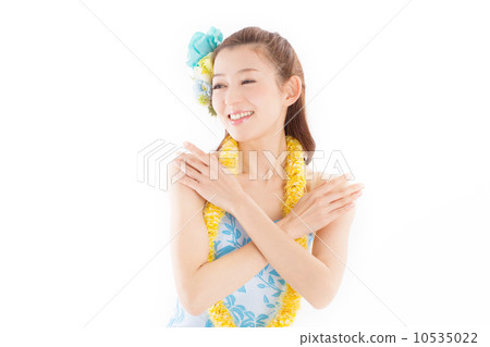 Beautiful and tropical atmosphere A beautiful woman dancing happily dressed in plenty of hula costumes Beautiful and tropical atmosphere A beautiful woman dancing happily dressed in plenty of hula costumes 10535022