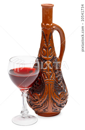 Ancient Georgian bottle and glass of wine on white background Ancient Georgian bottle and glass of wine on white background 10541734