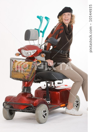 Disabled elderly woman with scooter 10544935