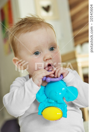 Cute baby girl with a toy 10545604
