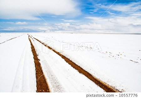 Tibet scene-The bank of lake Namtso bank covered with snow 10557776