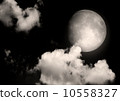 The moon in the night sky in clouds 10558327