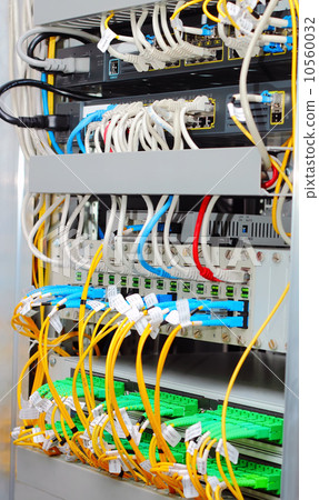 Stock Photo: fiber optic datacenter with media converters and optical cables