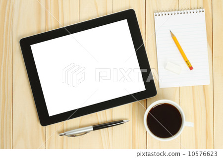 Tablet PC, cup of coffee with office supplies. 10576623