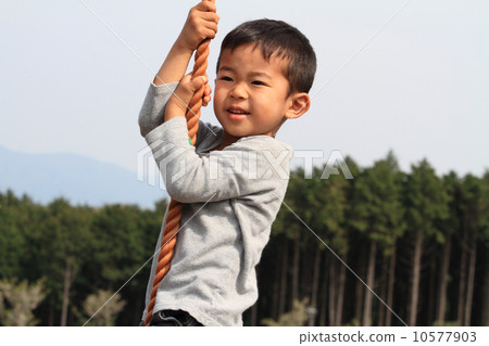 Infant playing with Tarzan rope (4 years old child) 10577903