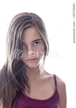 portrait of a serious female teenager with backlight, isolated o 10578084