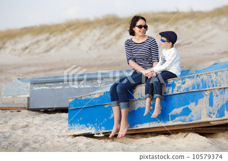 Mother and her little son sitting on a boat Mother and her little son sitting on a boat 10579374