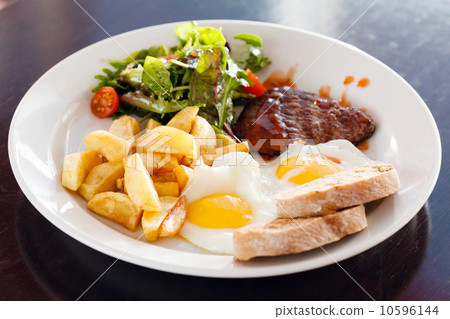 steak with eggs and vegetables 10596144