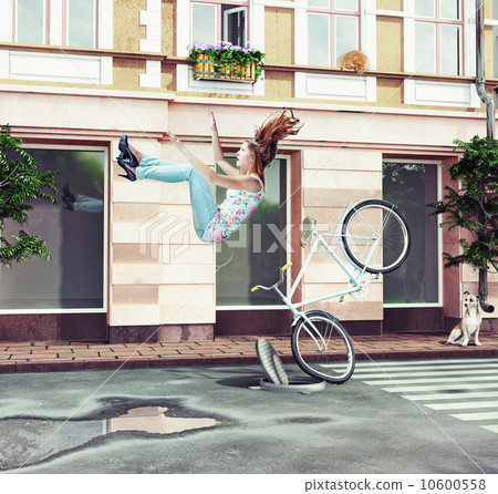 girl falling off her bicycle 10600558