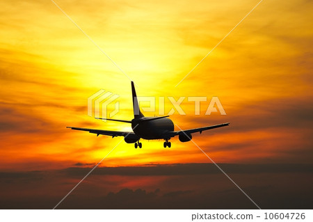 Airplane at the sunset Airplane at the sunset 10604726