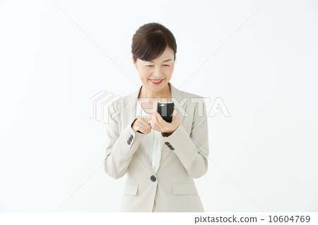 Senior female using a smartphone Senior female using a smartphone 10604769