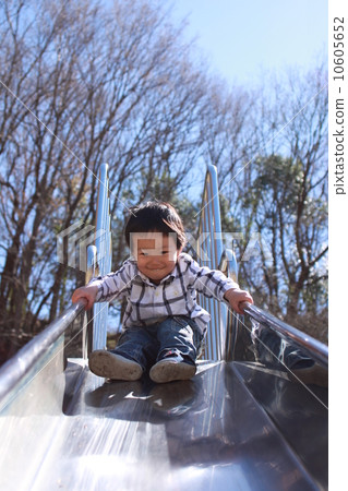 Boys enjoying the slide 10605652