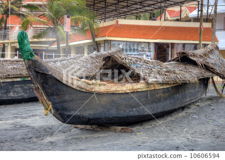 Fishing boat on Kovalam beach. Kerala, India  10606594