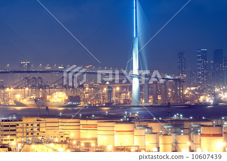 gas container and bridge at night 10607439