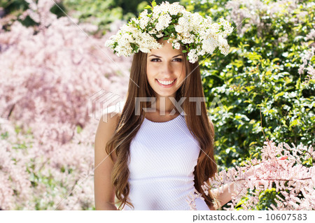 Beautiful girl on the nature in wreath of flowers Beautiful girl on the nature in wreath of flowers 10607583