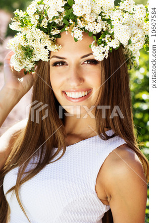 Beautiful girl on the nature in wreath of flowers Beautiful girl on the nature in wreath of flowers 10607584