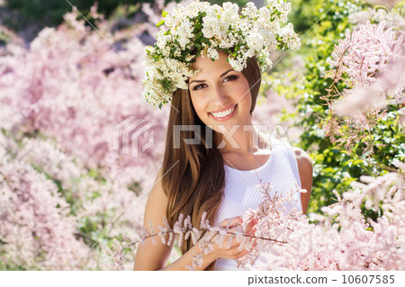 Beautiful girl on the nature in wreath of flowers Beautiful girl on the nature in wreath of flowers 10607585