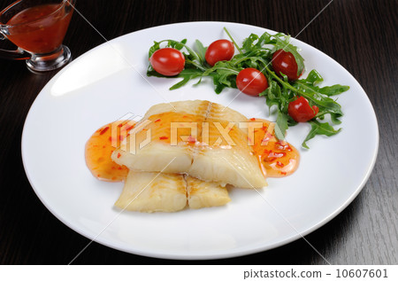 Flounder fillets in sauce with arugula and cherry tomatoes Flounder fillets in sauce with arugula and cherry tomatoes 10607601