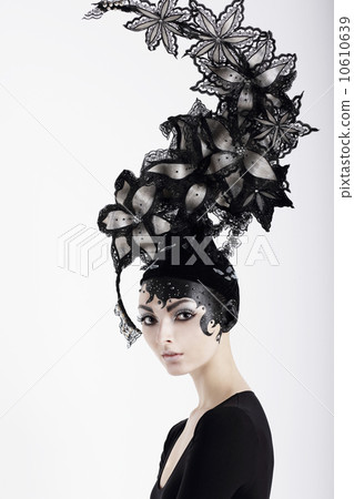 Stylish Eccentric Woman with Fanciful Make-up and Outlandish Hat 10610639