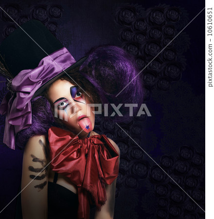 Burlesque. Humorous Comedian in Stagy Hat Showing Tongue Burlesque. Humorous Comedian in Stagy Hat Showing Tongue 10610651