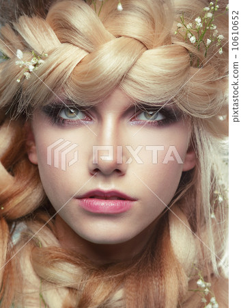 Closeup Portrait of Young Woman with Tress and Flowers Closeup Portrait of Young Woman with Tress and Flowers 10610652