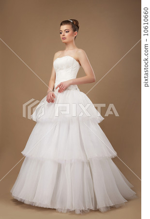 Elegance. Young Lady in Long Classic Bridal Dress 10610660