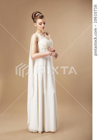 Simplicity. Stylish Woman in Sleeveless Dress 10610716