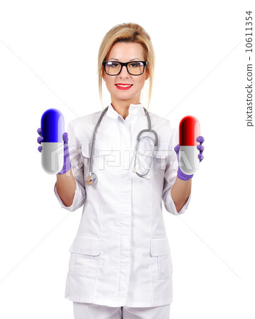 doctor holding two pills doctor holding two pills 10611354