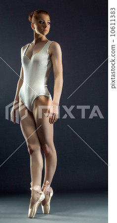 Slim red-haired girl posing on pointes Slim red-haired girl posing on pointes 10611383