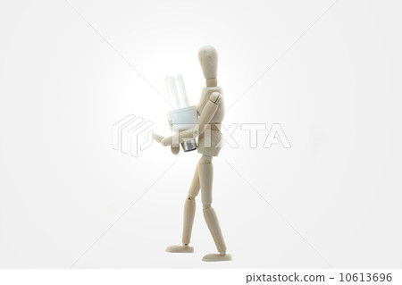 Wooden Manikin Doll Holding Low Energy Bulb Wooden Manikin Doll Holding Low Energy Bulb 10613696