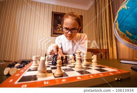 smart girl make move on chess board smart girl make move on chess board 10613934