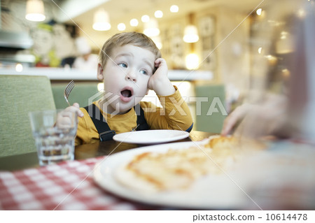 Young boy yawning as he waits to be fed Young boy yawning as he waits to be fed 10614478