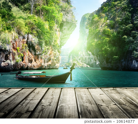 long boat and rocks on railay beach in Krabi, Thailand 10614877