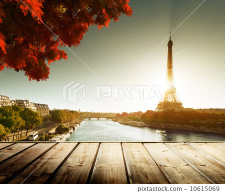 wooden deck table and Eiffel tower in autumn wooden deck table and Eiffel tower in autumn 10615069