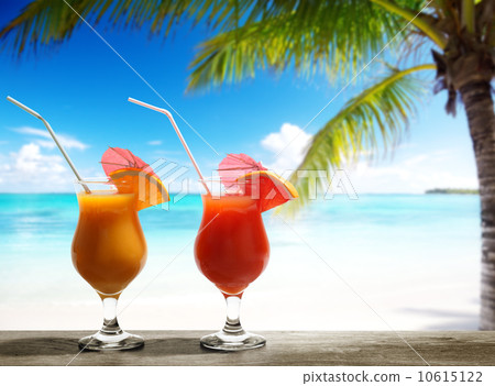 Two fresh juices on beach 10615122