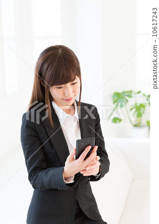Woman business watching smartphone Woman business watching smartphone 10617243