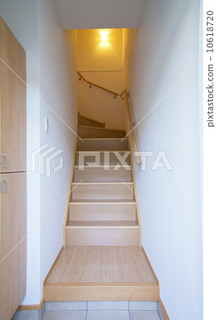 Looking up stairs with housing handrails Looking up stairs with housing handrails 10618720