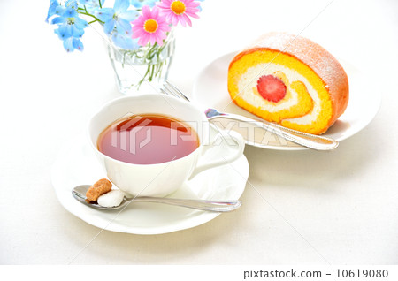Cute flower with roll cake and tea. 10619080