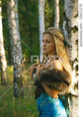 Fashion portrait of young sensual woman in garden Fashion portrait of young sensual woman in garden 10621170
