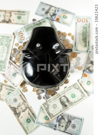photo of black piggy bank on dollar banknotes photo of black piggy bank on dollar banknotes 10621423