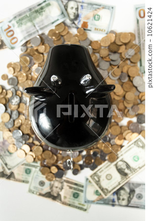 photo of black piggy bank on pile of coins 10621424