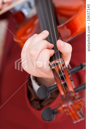 girl playing violin - chord on fingerboard girl playing violin - chord on fingerboard 10637140