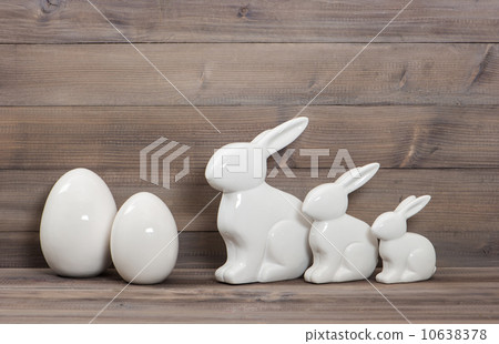 easter bunny family and white ceramic eggs 10638378