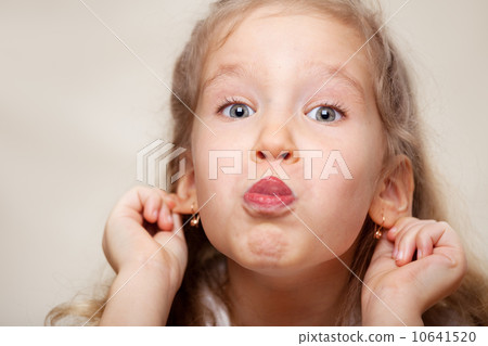 Grimacing child Grimacing child 10641520