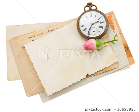 bunch of old papers with antique clock 10653953