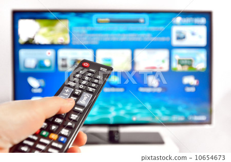 Smart tv and hand pressing remote control Smart tv and hand pressing remote control 10654673