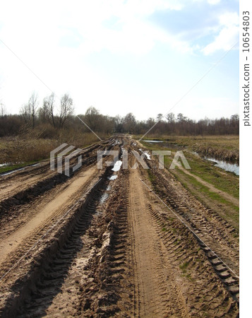 Rural road with dirt and greater traces of cars Rural road with dirt and greater traces of cars 10654803